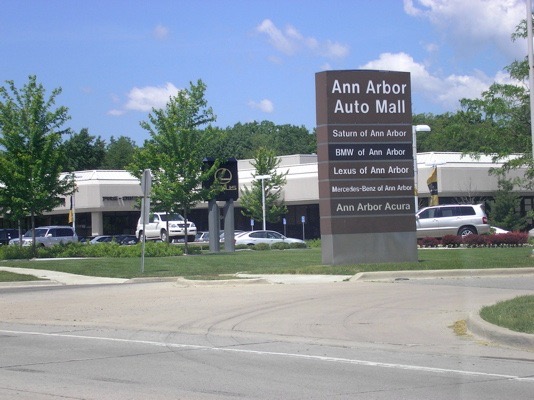 After you pass the Quality 16 theater, you will come up on the Ann Arbor Auto Mall and the Lexus dealership.  Turn away from them (left) onto Parkland Plaza