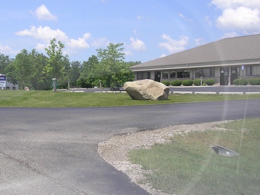 The second driveway on the right has this big rock: turn in here, 210 Little Lake drive.